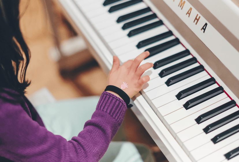 Piano being played with one hand